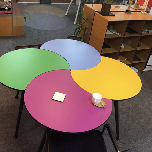 What are the advantages of making a table with compact laminate board?